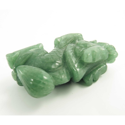 461 - A Chinese Green Jade Carving of a Miniature Dragon, 20th century, 5.4cm long