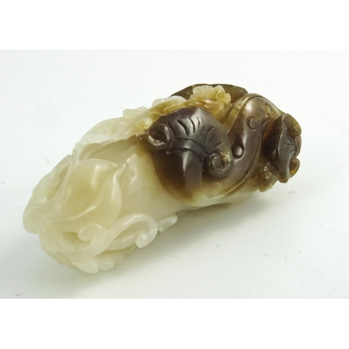 467 - A Chinese Jade Carving of a Finger Citron, pale white and brown tones, 7cm high