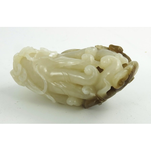 467 - A Chinese Jade Carving of a Finger Citron, pale white and brown tones, 7cm high