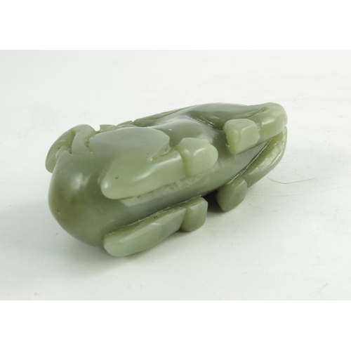 468 - A Chinese Jade Horse, the finely carved recumbent horse, its head turned back surveying a small monk... 