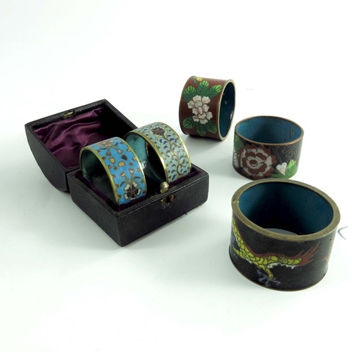 481 - Four Chinese Cloisonne vases, 20th century, with five napkin rings, all decorated with floral design... 