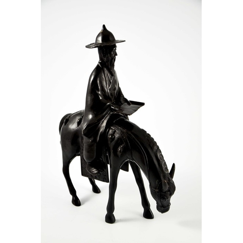 483 - An Oriental bronze figure of a man on a horse, probably 19th century Chinese, 37cm high