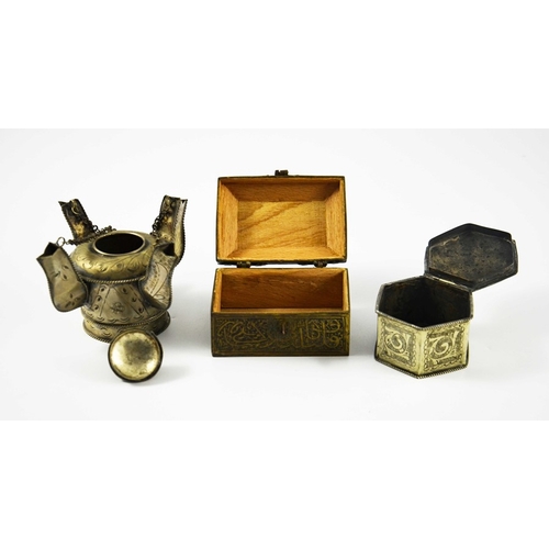 486 - Three Persian metal vessels, including two boxes, engraved with Islamic and Arabic script and foliat... 