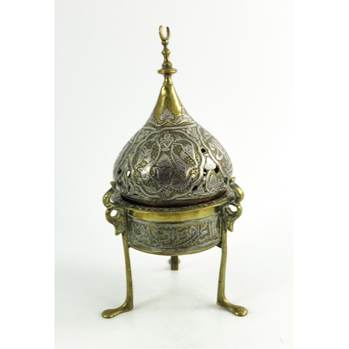 487 - A 19th century or earlier Persian cairoware brass and silver overlay incense burner and cover, the c... 