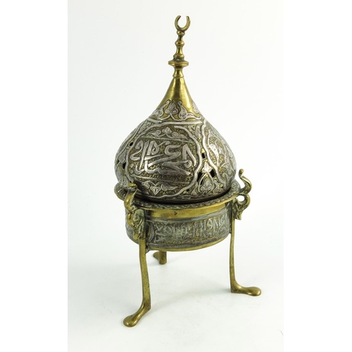 487 - A 19th century or earlier Persian cairoware brass and silver overlay incense burner and cover, the c... 