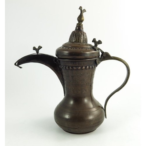 489 - A 19th century Middle Eastern Arabic dallah coffee pot, copper, Islamic form, stamped and embossed w... 