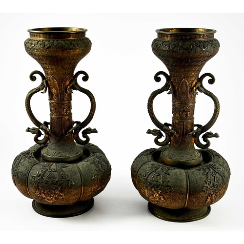 490 - A large pair of Japanese bronze vases, Meiji, melon and shaft form, heavily cast in relief with rose... 