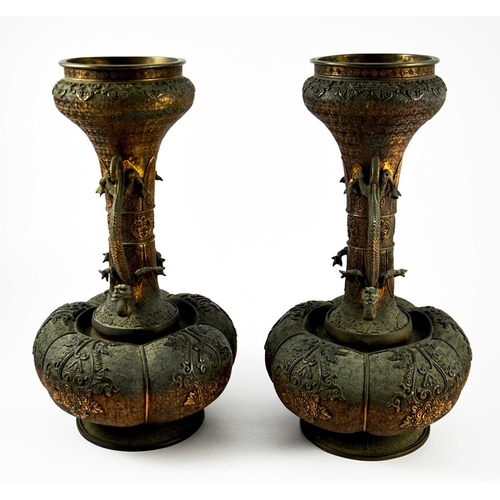 490 - A large pair of Japanese bronze vases, Meiji, melon and shaft form, heavily cast in relief with rose... 