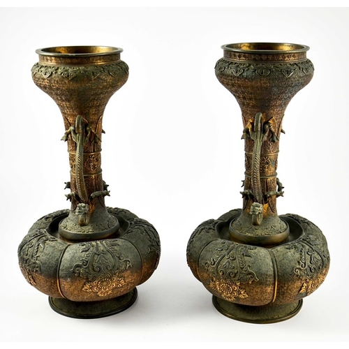 490 - A large pair of Japanese bronze vases, Meiji, melon and shaft form, heavily cast in relief with rose... 