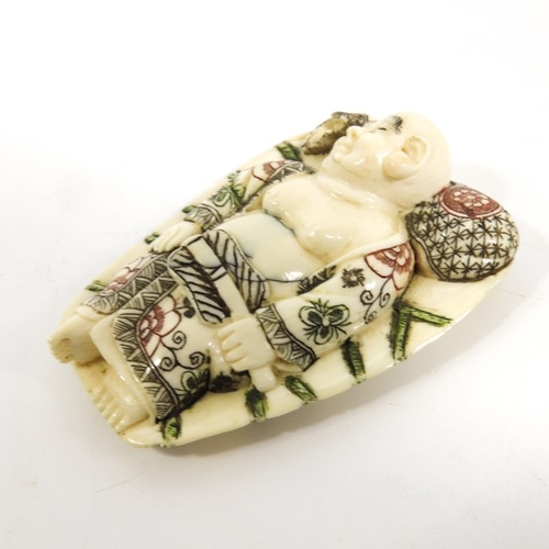 495 - λ A 19th century Japanese ivory netsuke, Meiji, modelled as a sleeping man, 6cm long