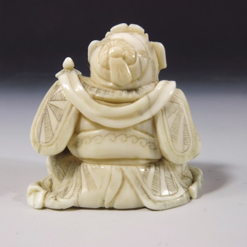 496 - λ A 19th century Japanese carved ivory okimono, Meiji, modelled as a sitting man with temple and bow... 