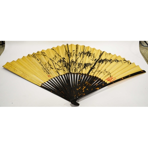 500 - A large fan, Chinese circa 20th century, the frame of lacquered bamboo with gilt highlights, the pap... 