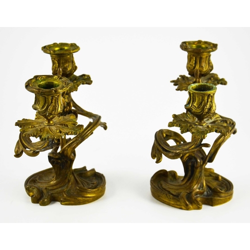 524 - A pair of 19th century French ormolu candelabra, twin branch, Rococo foliate scroll casting with cen... 