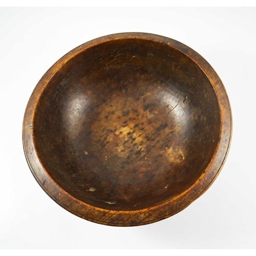 532 - A 19th century or earlier turned treen bowl, fruitwood with concentric banding, 35cm diameter