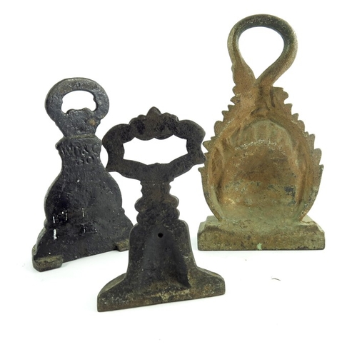 533 - Three Victorian cast iron door stops, one modelled as lion with ring handle as a tail, highest 28cm ... 