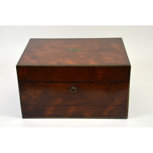 534 - A mid 19th century mahogany vanity case inlaid with brass edging, containing silver topped glass bot... 