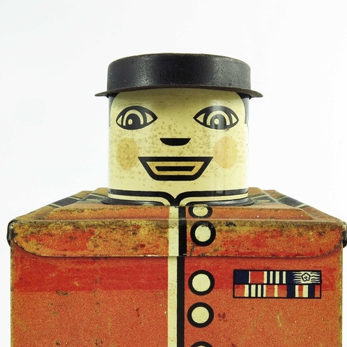 536 - Huntley and Palmers, a Guardsman biscuit tin, circa 1956, cuboid form, modelled as a soldier, 21.5cm... 