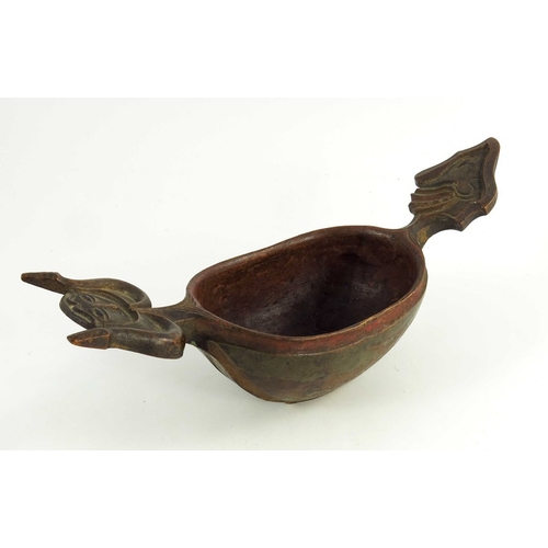 537 - A Scandinavian carved wooden  kasa or drinking bowl, modeled with grotesque heads for handles, hand-... 