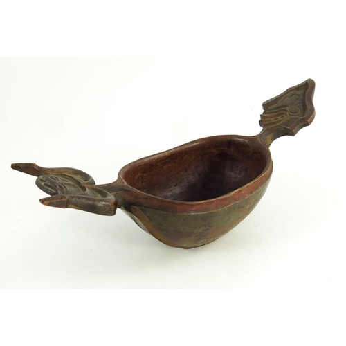 537 - A Scandinavian carved wooden  kasa or drinking bowl, modeled with grotesque heads for handles, hand-... 