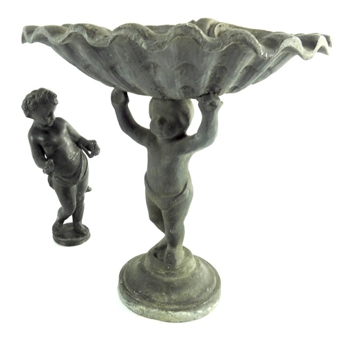 541 - A 19th century lead figural tazza, modelled as a putto holding a conch shell above his head, togther... 