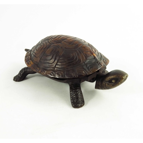 547 - A Victorian Cast iron mechanical table bell modelled as a tortoise, the tortoiseshell back mounted o... 