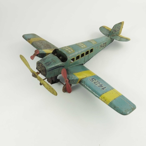 553 - A German Tippco tinplate plane, circa 1933,  clockwork mechanism and rotating front propeller, numbe... 