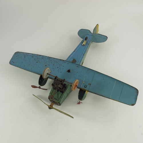 553 - A German Tippco tinplate plane, circa 1933,  clockwork mechanism and rotating front propeller, numbe... 