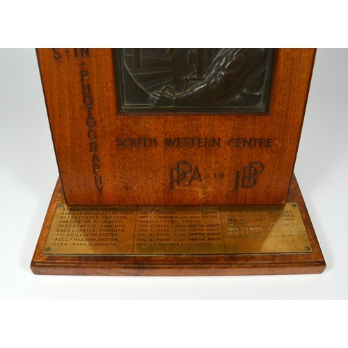 557 - A bronze trophy plaque for Progress in Photography south western centre, base with brass plate showi... 