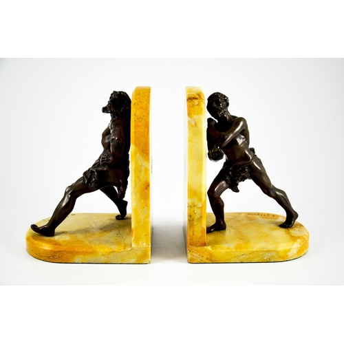 569 - Jean Louis Gregoire, a pair of bronze and Sienna marble bookends, modelled as cave men in animated s... 