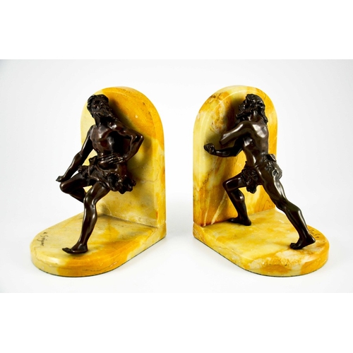 569 - Jean Louis Gregoire, a pair of bronze and Sienna marble bookends, modelled as cave men in animated s... 