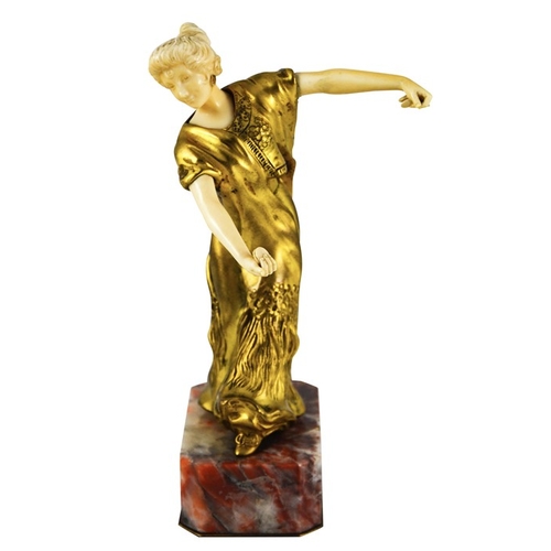 571 - Louis Barthelemy, an Art Deco gilt bronze and ivory figure of a Spanish dancer, circa 1925, on red m... 