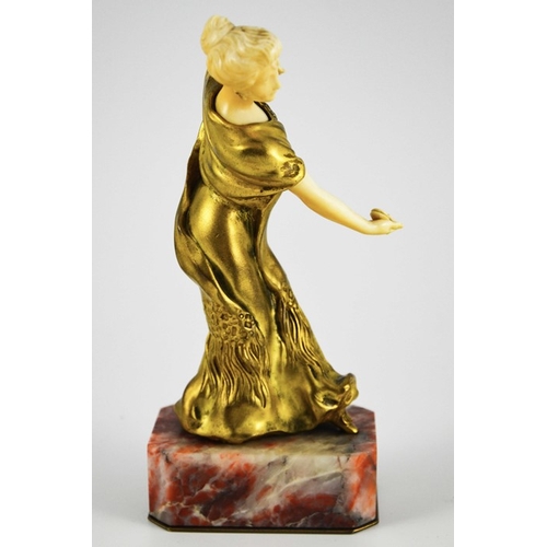 571 - Louis Barthelemy, an Art Deco gilt bronze and ivory figure of a Spanish dancer, circa 1925, on red m... 