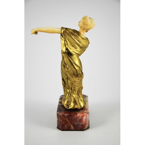 571 - Louis Barthelemy, an Art Deco gilt bronze and ivory figure of a Spanish dancer, circa 1925, on red m... 