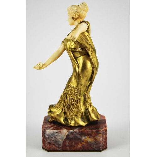 571 - Louis Barthelemy, an Art Deco gilt bronze and ivory figure of a Spanish dancer, circa 1925, on red m... 