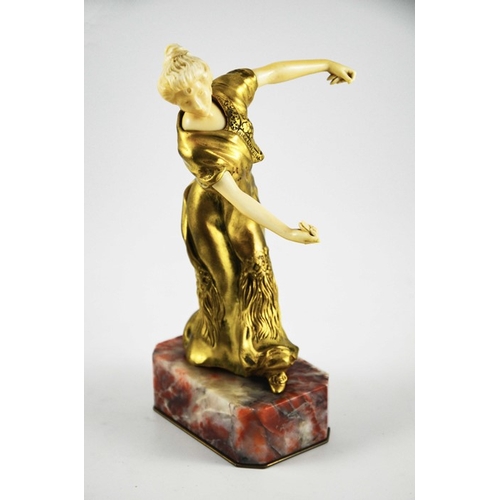 571 - Louis Barthelemy, an Art Deco gilt bronze and ivory figure of a Spanish dancer, circa 1925, on red m... 