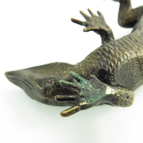 573 - Max Le Verrier, a bronze sculpture of a lizard, circa 1925, signed Le Verrier, 25cm long.