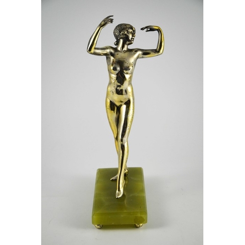 576 - An Art Deco silvered bronze figure of a nude flapper, circa 1925, in the style of Colinet, on green ... 