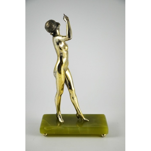 576 - An Art Deco silvered bronze figure of a nude flapper, circa 1925, in the style of Colinet, on green ... 