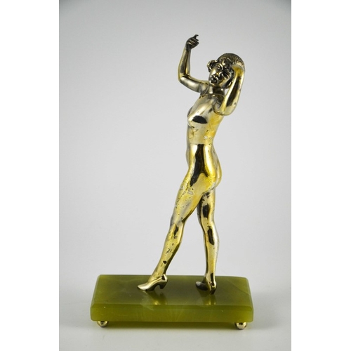 576 - An Art Deco silvered bronze figure of a nude flapper, circa 1925, in the style of Colinet, on green ... 