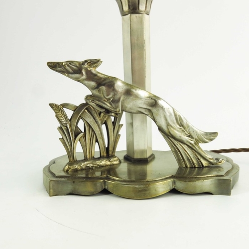 585 - An Art Deco silvered lamp, with opalescent frosted shade, modelled with leaping dog and wheat, 31cm ... 