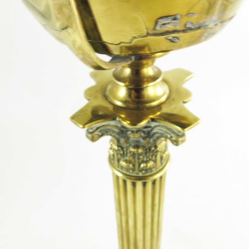 587 - A Victorian brass oil lamp, Corinthian column form with brass font on a square stepped base, marked ... 