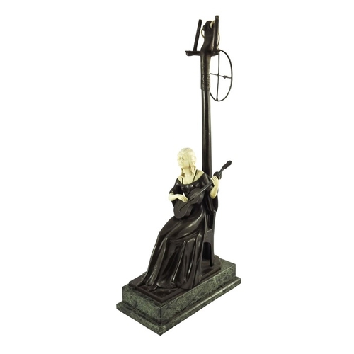 590 - A Continental Bronze and Ivory Figurative Lamp circa 1900, modelled as a seated lady playing a guita... 