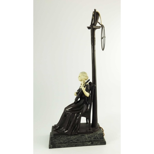 590 - A Continental Bronze and Ivory Figurative Lamp circa 1900, modelled as a seated lady playing a guita... 