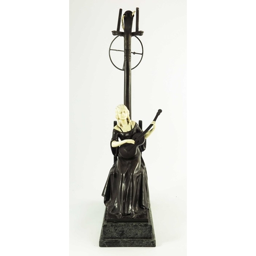 590 - A Continental Bronze and Ivory Figurative Lamp circa 1900, modelled as a seated lady playing a guita... 