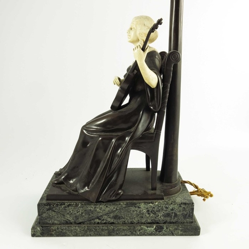 590 - A Continental Bronze and Ivory Figurative Lamp circa 1900, modelled as a seated lady playing a guita... 