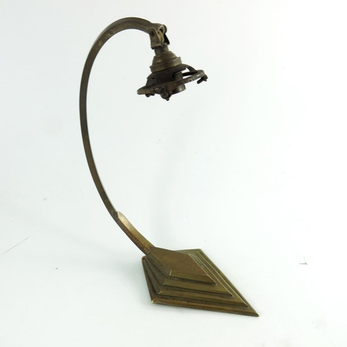 592 - An Art Deco brass table lamp, stepped diamond foot and square section looped arm support