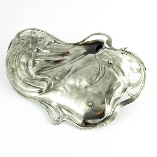 602 - WMF, a Jugendstil silver plated card tray, modelled in relief as a woman reading, reclining on an op... 