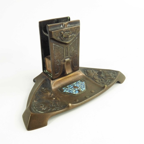 608 - A Jugendstil copper and cloisonné enamelled desk set, cast with stylised roses and set with mosaic t... 