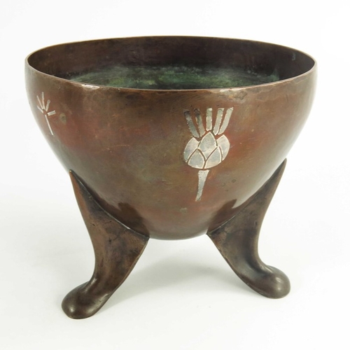 610 - An early 20th century copper and silver overlaid vessel, HCH, supported on three footed legs with si... 