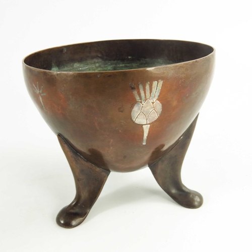 610 - An early 20th century copper and silver overlaid vessel, HCH, supported on three footed legs with si... 